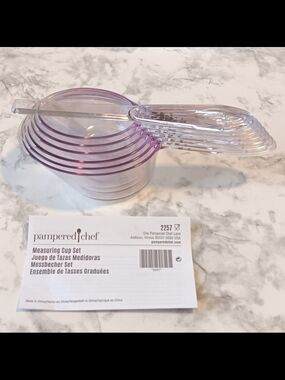 Authentic Pampered Chef
Complete 7-piece measuring cup set Snap-Together Design